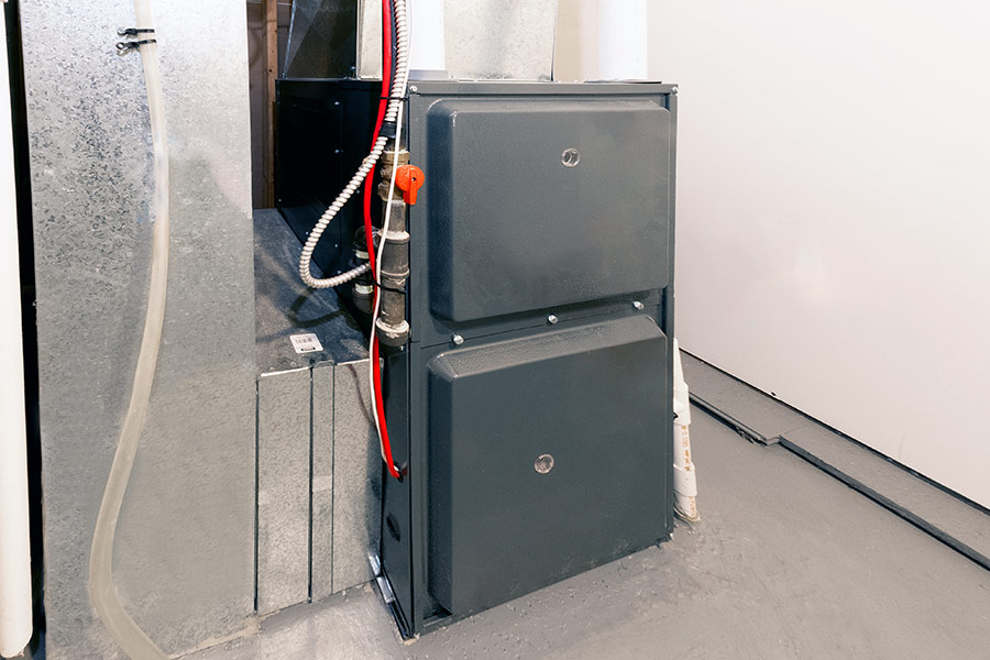 Furnace with connected pipes and wiring.